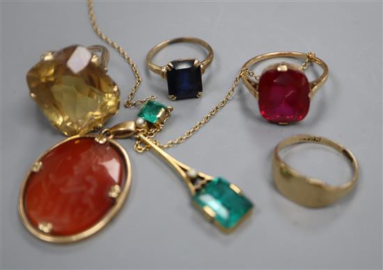 Three assorted yellow metal rings including 10k and two pendants including 9ct and one with carved oval carnelian.